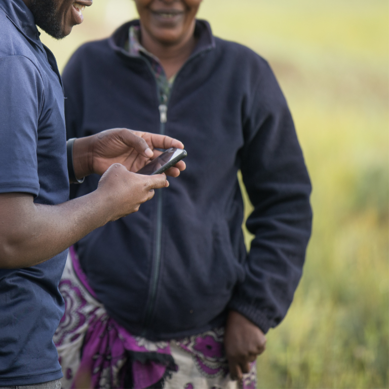Farmforce Man using the Farmforce software, in the field.